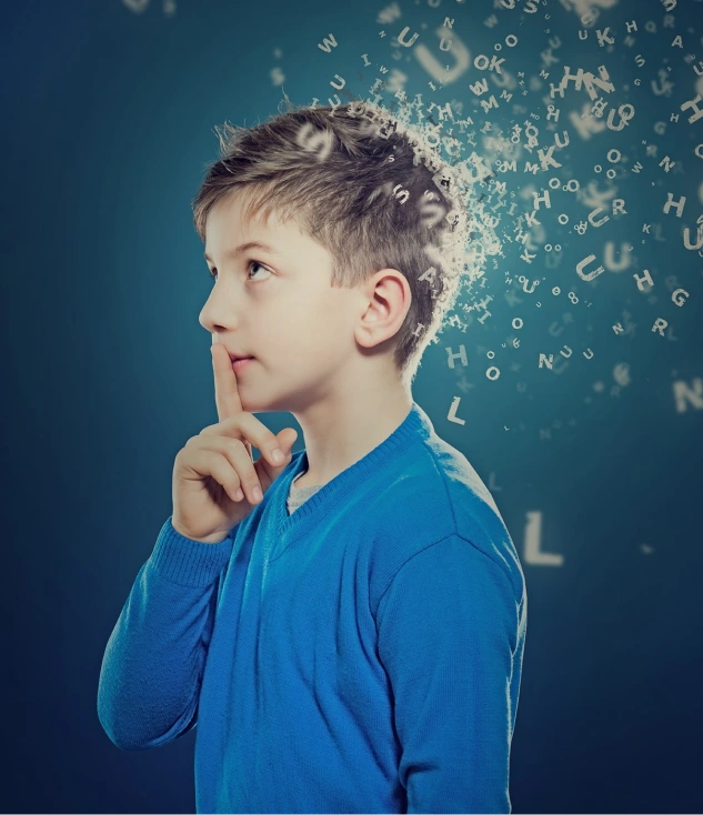 Boy in blue shirt thinking, with letters floating from his head, photo.
