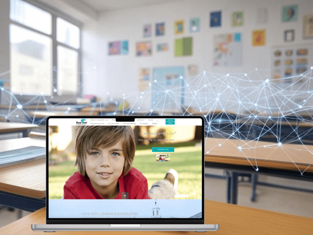 Laptop displaying a website with a child, in a classroom setting.