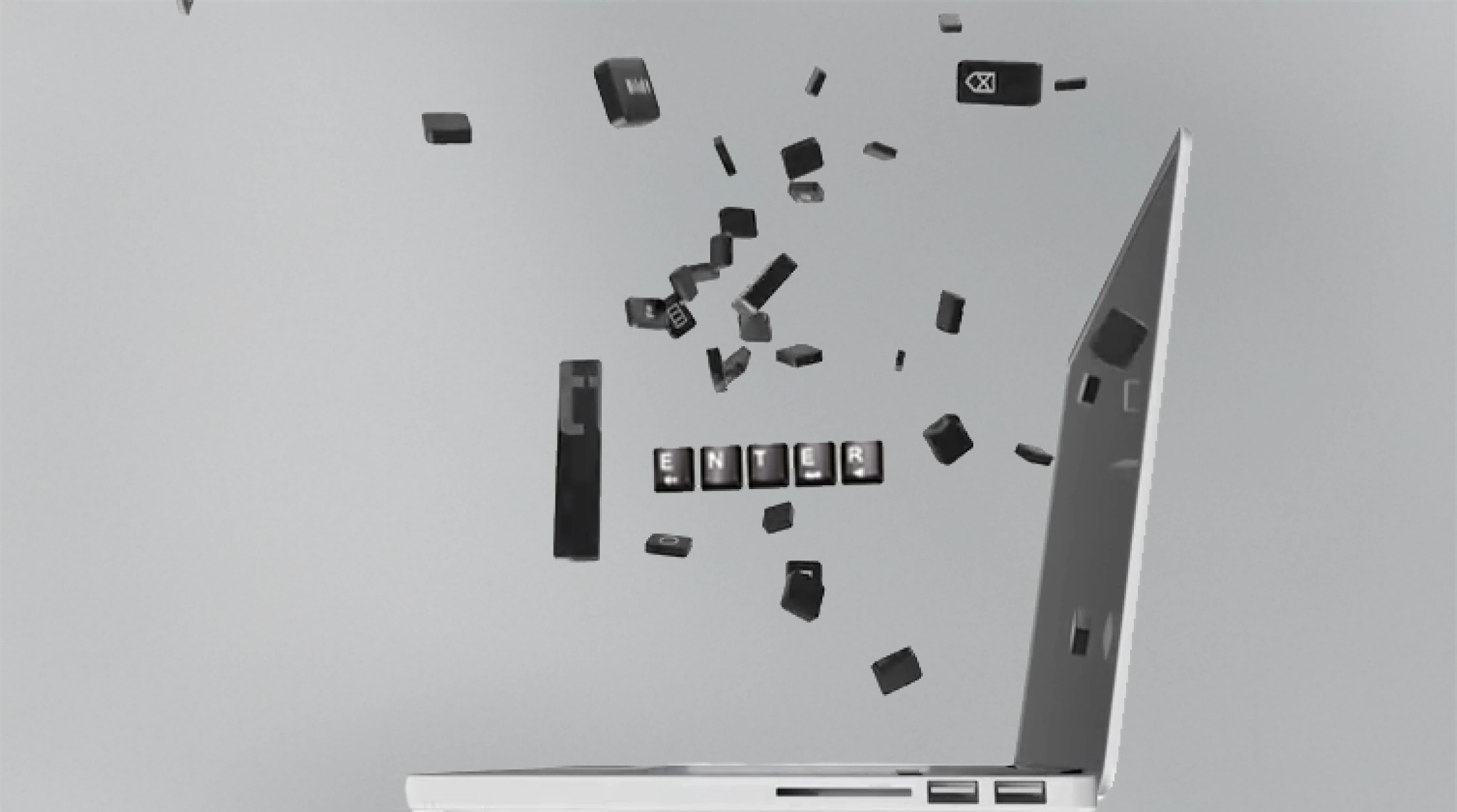 Laptop with keys flying off, black and white, digital illustration.